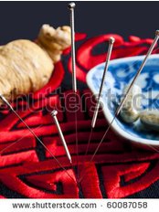 stock-photo-acupuncture-needles-ginseng-root-and-herbal-pills - Mulberry Acupuncture Clinic
