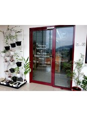 Mayura Apothecary - Front door with a small herbs garden 
