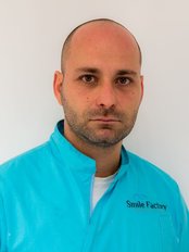 Dr Peter Kumitski -  at Smile Factory Dental Clinic
