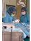 Clínica CosDent Dr. Roberto Sauma - Dr. Sauma placing implants 