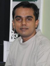 Ivories Dental Clinic & Dental Implant Clinic - DR ALAAP SHAH (BDS, MDS, MIPS) PROSTHODONTIST & IMPLANTOLOGIST 