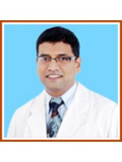 Dr Siddhartha Pujari - Dentist at Smilekraft Multispeciality Dental Clinic Bangalore