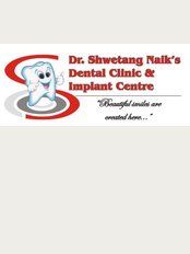 Dr Shwetang Naik's Dental Clinic & Implant Centre - 5-6, Ground Floor, Devkrup Apts, Near Jaykisan Hospital, Opp. Petrol Pump, Gandevi, Navsari, Gujarat, 396445, 