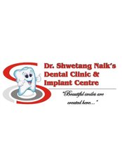 Dr Shwetang Naik's Dental Clinic & Implant Centre - 5-6, Ground Floor, Devkrup Apts, Near Jaykisan Hospital, Opp. Petrol Pump, Gandevi, Navsari, Gujarat, 396445,  0