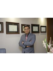 Dr Kamlesh Kothari - Oral Surgeon at Aesthetica - Specialty Dental Clinic