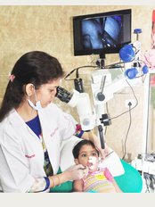 Make My Smile Multispecialty Dental Clinic - Treatment Being Done By Latest Machines Including Dental Operating Microscope