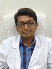 Dr Ravi Sureja - Dentist at Suresmile Multi-speciality Dental Clinic