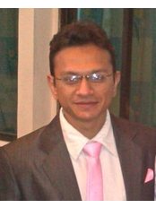 Dr Raj Sureja - Oral Surgeon at Suresmile Multi-speciality Dental Clinic