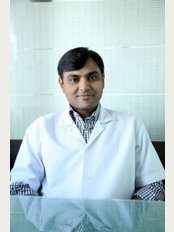 Unique Dental Care - Dr.Mahesh  Aghera B.D.S.,M.D.S (Orthodontics)  Dr.Mahesh-Bachelor of Dental Surgery-B.D.S