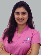 Monarch Dental Clinic - Vadodara - Dr. Aesha Patel 