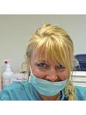 Dr Andrea Baucer - Dentist at Total Care Dental Studio