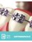 Estrada Dental Group - Conventional braces with color ties. 
