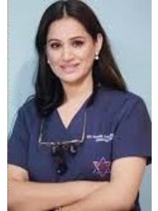 Dr Nisha Acharya - Consultant at Braces and Faces Dental Clinic