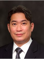 Dr Gordon Tam -  at Implantdontics Cosmetic and Implant Dentistry