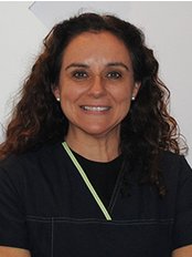 Dr Ma Auxiliadora  Peinado Real -  at Mi Clinik Dental & Estetica