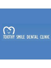 Dr Songsiri Pongburanakit - Dentist at Toothy Smile Dental Clinic