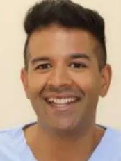 Dr Romain Prasad - Dentist at Dental Care Centre