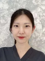 Dr Woo-Young -  at Dental Care Centre