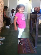 a spinal cord injury patient trying to stand independently - SAINI PHYSIOTHERAPY AND CHILD DEVELOPMENT CLINIC