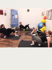 First Class Physiotherapy - Foam rolling class in action!
